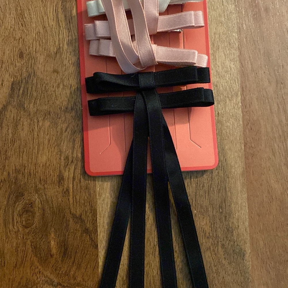 Perfect for fine hair! 3 sets of bow-tie hair pins. 
Black, cream & pink